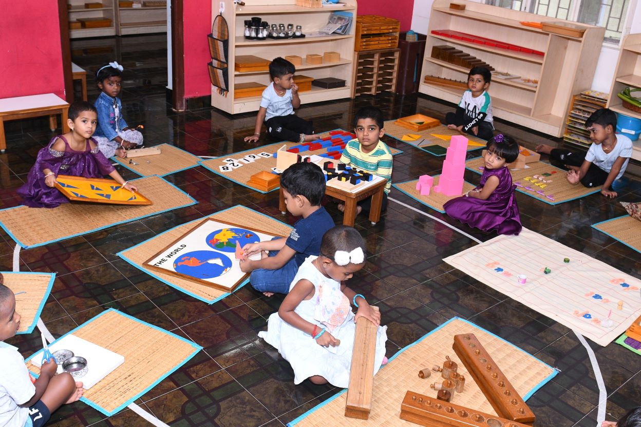 A child learning with Montessori materials